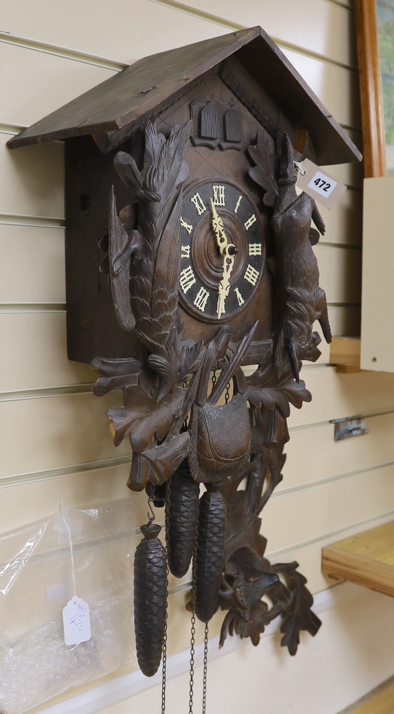 A Black Forest cuckoo clock with double cuckoo, approximately 30cm high